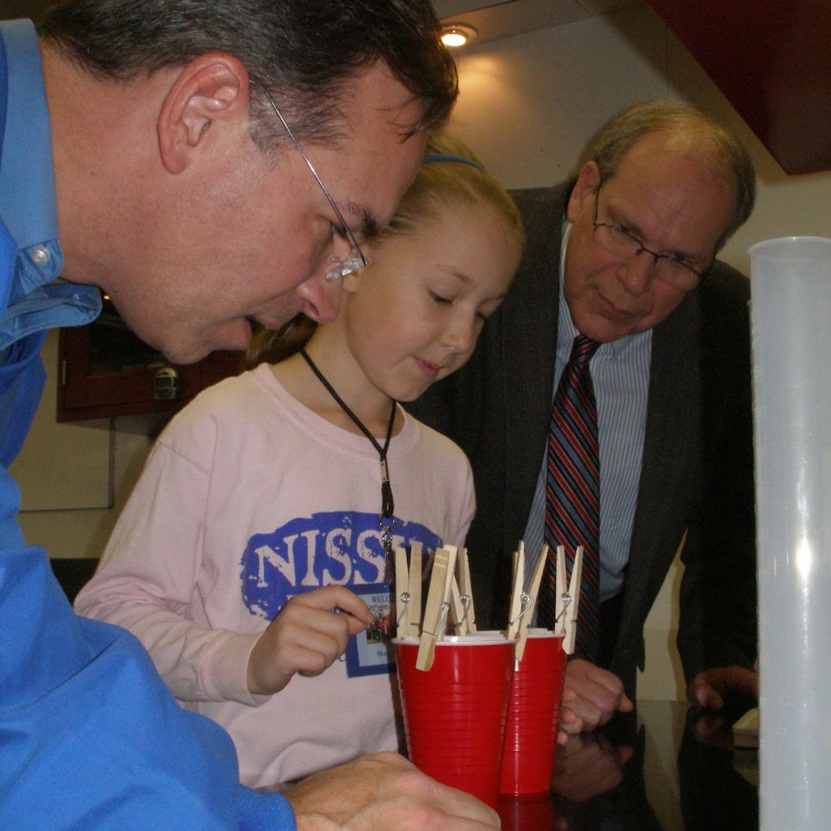 Mary showing her experiment to others